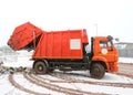 Orange waste collection truck