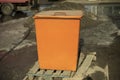 Orange waste tank. Dumpster
