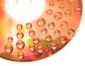 Orange water drop on disk Royalty Free Stock Photo