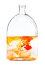 Orange watercolors dissolving in water in flask Royalty Free Stock Photo