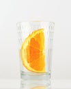 Orange wedge in glass Royalty Free Stock Photo