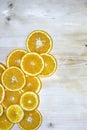 Orange wedges lying on a wooden table.