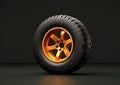 An orange wheel and tire on a black background