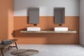 Orange and white bathroom interior, double sink Royalty Free Stock Photo