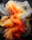 an orange white and grey swirl of fabric on a black background Royalty Free Stock Photo