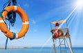 Lifebuoy and a Lifeguard on Surveillance Tower