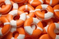 Orange and white life preservers. Generative AI Royalty Free Stock Photo