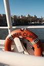 Orange and white life ring atop a boat in a marina or dock Royalty Free Stock Photo