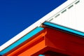 Orange and white modern roof top building in blue sky background Royalty Free Stock Photo