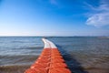 Orange and white plastic buoys in the sea Royalty Free Stock Photo