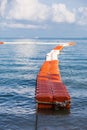 Orange and white plastic buoys in the sea Royalty Free Stock Photo