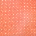 Orange and white polka fabric