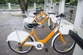 Orange white Public bicycles for rent in Waroros Market, Chiang Mai thailand