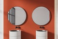 Orange and white tiled bathroom with double sink Royalty Free Stock Photo