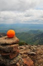 Orange on the wild stone pyramid Royalty Free Stock Photo