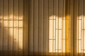 Orange window curtains with sunlight through, interior design