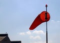 ORANGE WINDSOCK ON AIRFIELD