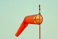 Orange windsock at airport