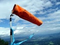 The orange windsock (weathervane) on top of the mo