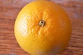 Orange on wood table, closeup