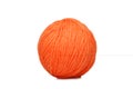 Orange yarn ball over white