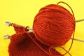Orange yarn and knitting needles Royalty Free Stock Photo