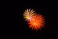 Orange, yellow, blue and pink fireworks shine bright in the sky Royalty Free Stock Photo