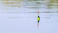 Orange bobber on the water surface Royalty Free Stock Photo