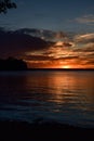 Summer sunset on the horizon across Minnesota lake