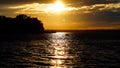 Summer sunset on the horizon across Minnesota lake