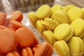 Orange and yellow macaron cake on the counter. Appetizing popular dessert. Close-up