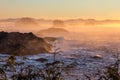 Orange, yellow and pink mist over Pacific Ocean, Ucluelet, BC Royalty Free Stock Photo
