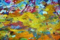 Orange yellow purple blue gold paint blurred splashes, colorful vivid waxy colors, contrasts creative background Royalty Free Stock Photo