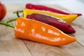 orange, yellow and red bell pepper and costoluto genovese tomato Royalty Free Stock Photo