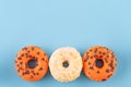 orange and yellow sprinkled donuts on blue background Halloween high-quality photos for calendar and cards. Space for text Royalty Free Stock Photo