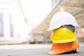 Orange yellow and white hard safety wear helmet hat in the project at construction Royalty Free Stock Photo