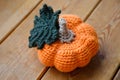 Orange-yellow wicker pumpkin on a tree background. Preparing for the Halloween concept. Top view. Handmade creative Royalty Free Stock Photo