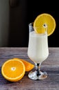 Orange and yoghurt smoothie in glass on wooden table Royalty Free Stock Photo