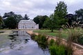Orangery at the newly renovated Gunnersbury Park and Museum on the Gunnersbury Estate West London UK reflected in the lake