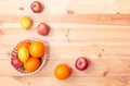 Oranges, apples and lemons in wicker basket and near. Selective focus. Top view, copy space Royalty Free Stock Photo