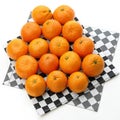 Oranges on a checkered background on white background Royalty Free Stock Photo