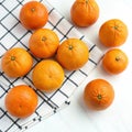 Oranges on a checkered background on white background Royalty Free Stock Photo