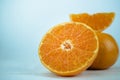 Oranges, close up whole orange fruit and sliced oranges on wood Royalty Free Stock Photo