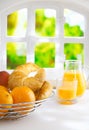 Oranges and croissants for a summer breakfast Royalty Free Stock Photo