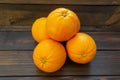 Oranges freshly picked off the three ready to be eaten on the kitchen table.