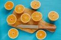 Oranges, orange juice and slices of fruit in blue background