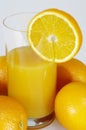 Oranges and glass of orange juice Royalty Free Stock Photo