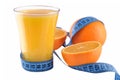 Oranges, glass of orange juice and measuring tape Royalty Free Stock Photo