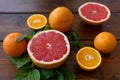 Oranges and grapefruit on a brown wooden background, text space, citrus Royalty Free Stock Photo