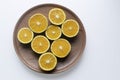 oranges in halves on a wooden plate